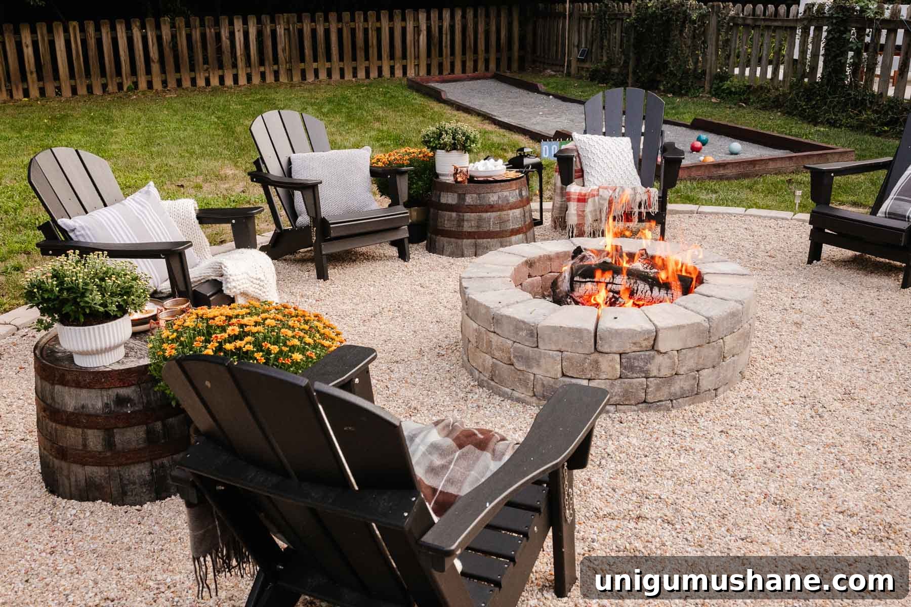 backyard fire pit with fall decor for a backyard party
