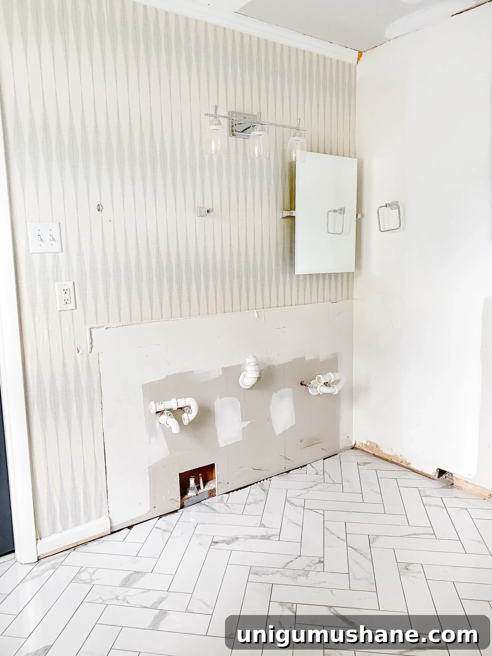 Faux Marble Herringbone Tile and Shower Renovation Update 11 faux marble herringbone tile floor in a bathroom renovation