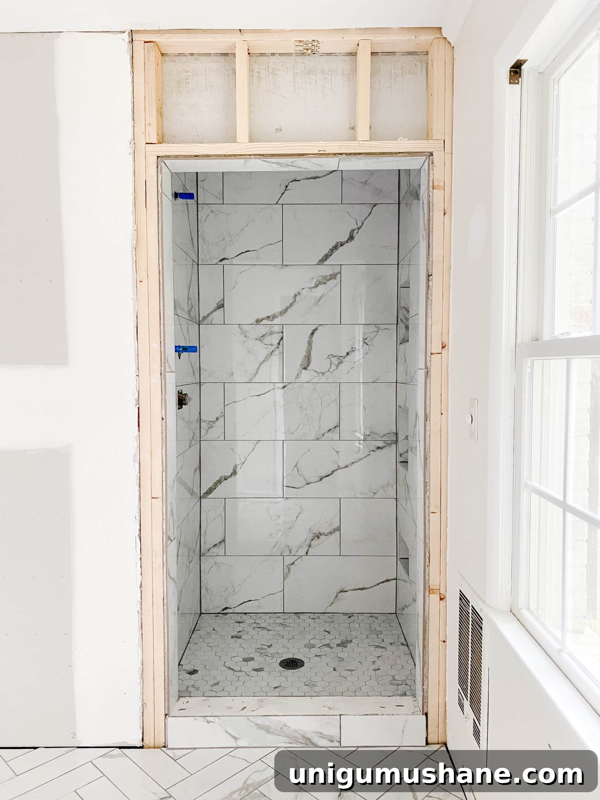 Faux Marble Herringbone Tile and Shower Renovation Update 5 faux marble tile shower