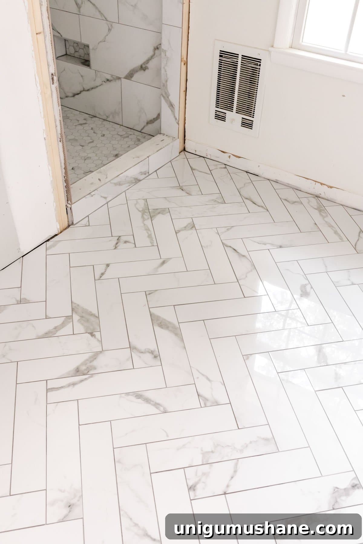 Faux Marble Herringbone Tile and Shower Renovation Update 7 faux marble herringbone tile floor and faux marble tile shower with hexagon