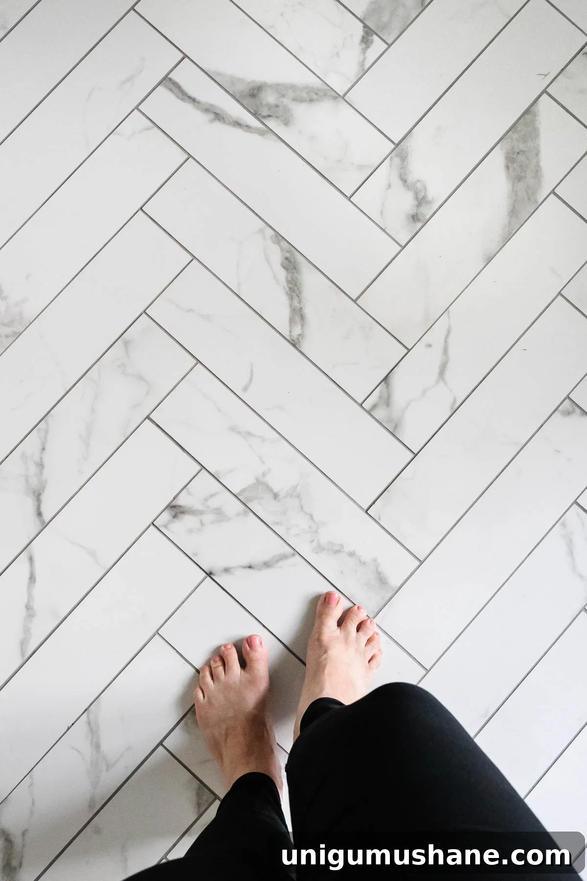 Faux Marble Herringbone Tile and Shower Renovation Update 8 faux marble herringbone tile floor with gray grout