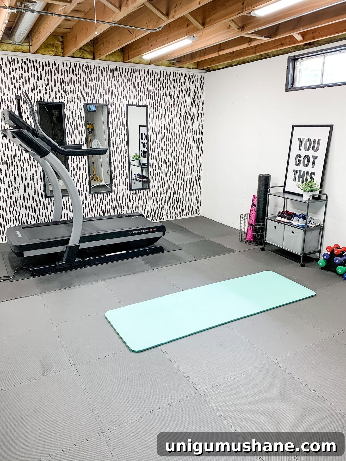 DIY Home Gym Ideas for Basements, Garages, and Sheds 12 home gym with brushstroke accent wall in a basement
