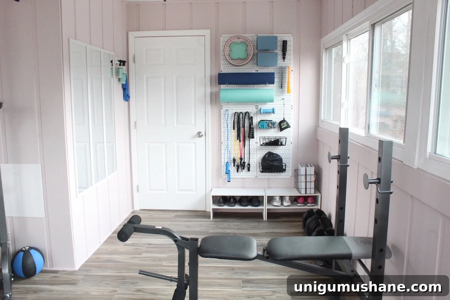 DIY Home Gym Ideas for Basements, Garages, and Sheds 9 workout room with wall organizer pegboard for small workout equipment