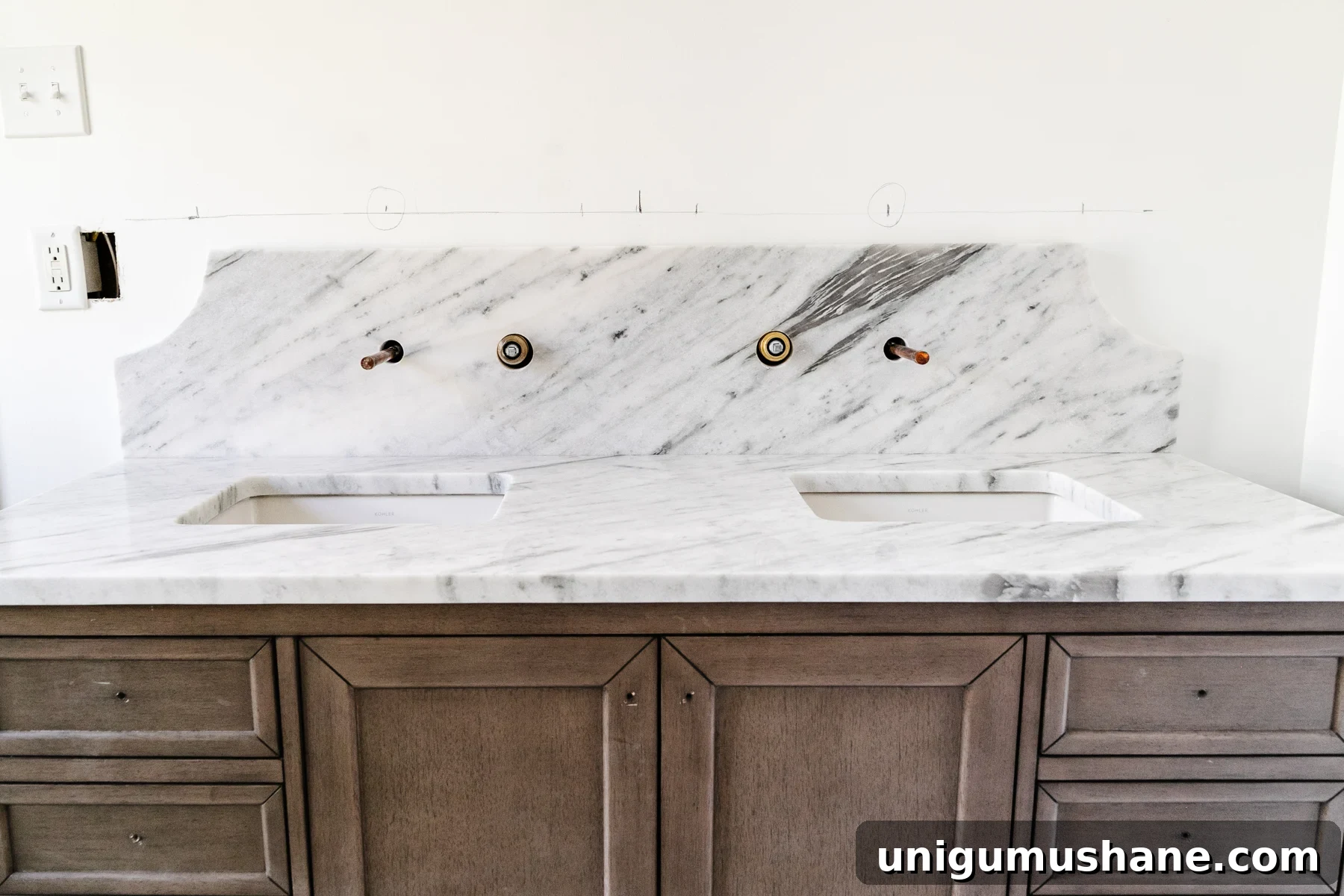 marble countertop and scalloped backsplash