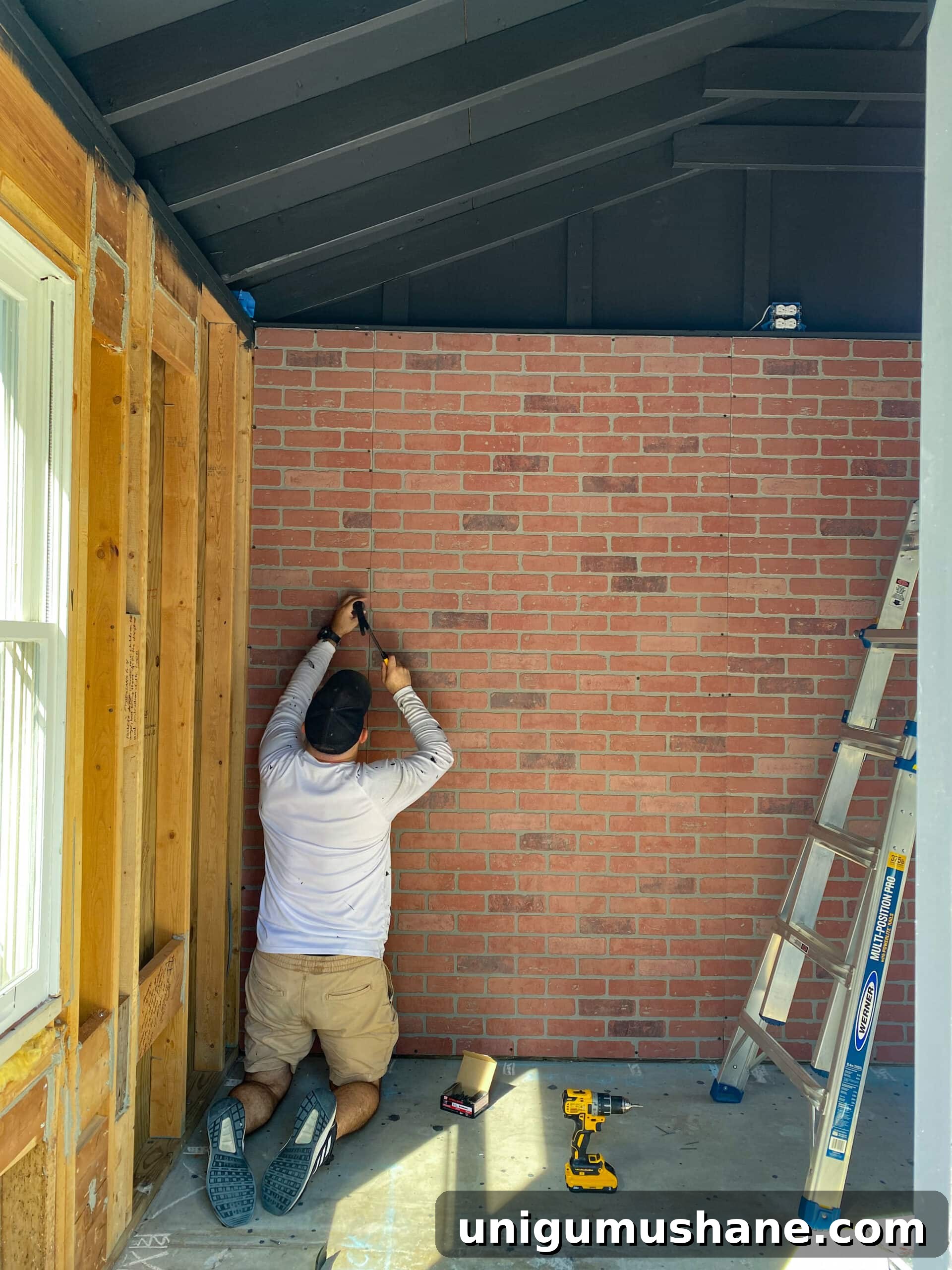 cutting and hanging faux brick wall panels
