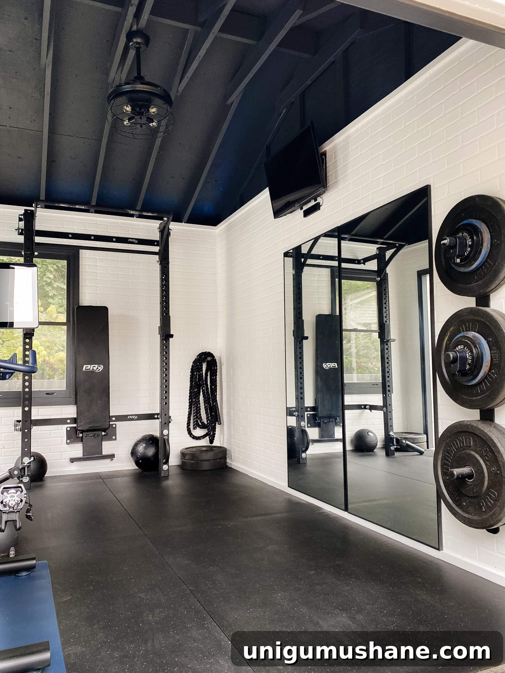 Convert Your Shed into a Home Gym on a Budget 7 at home gym shed with mirrors and faux brick walls