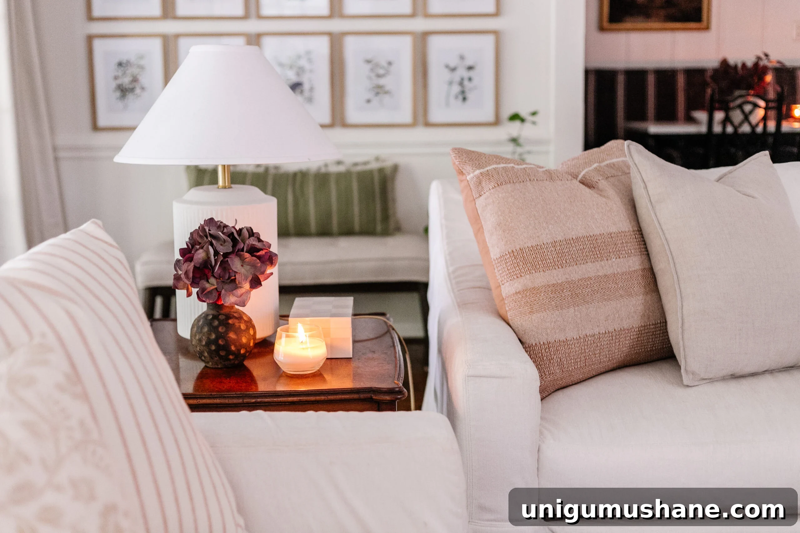 nesting end tables in a living room between white couches 