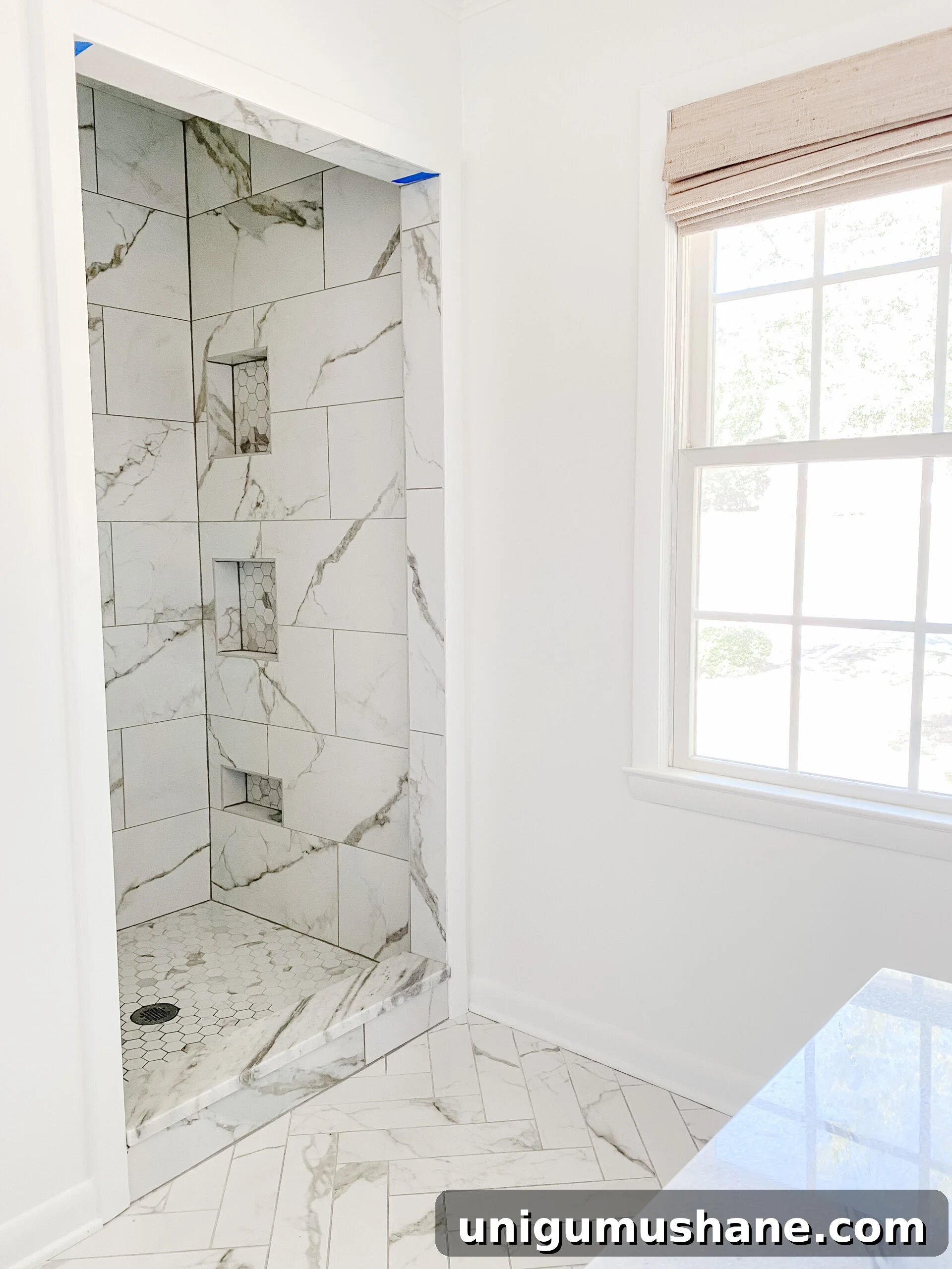 En Suite Bathroom Remodel: New Faucets Installed 7 marble look porcelain tile shower with shower niches