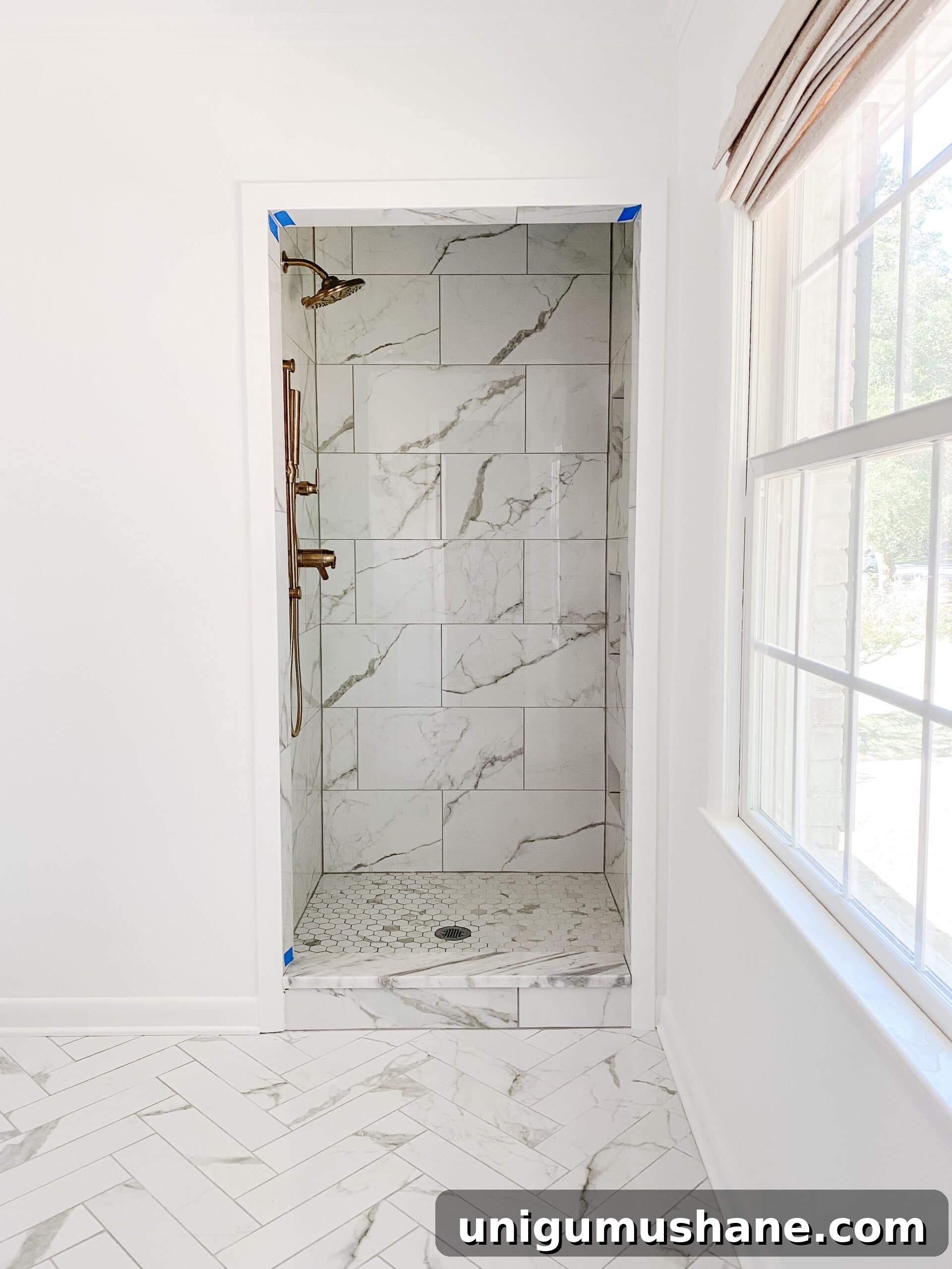 En Suite Bathroom Remodel: New Faucets Installed 10 faux marble porcelain tile shower