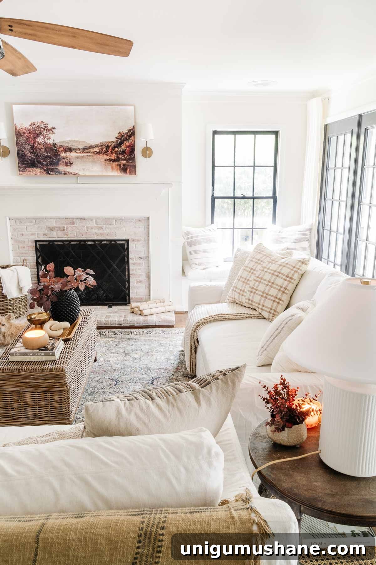 Pottery Barn Sofas Reviewed: Key Facts Before You Buy 13 white slipcovered slope arm york pottery barn sofa with fall decor in living room