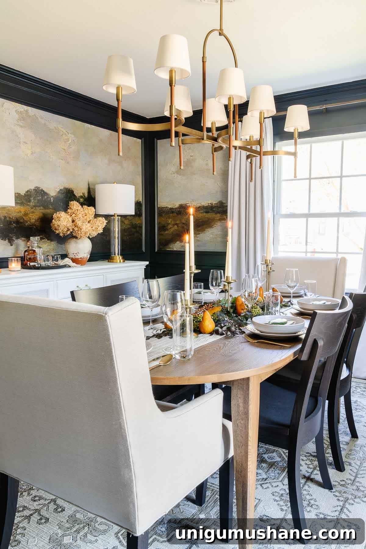 10-Minute Thanksgiving Table Decor Ideas 9 Thanksgiving decor in the dining room with candles, navy walls, and leaves