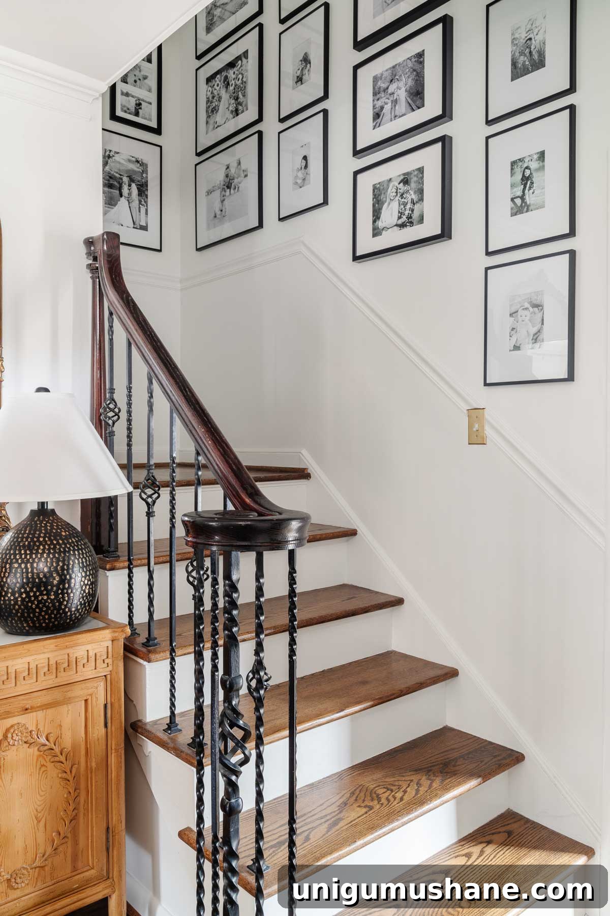 gallery wall with black frames and black and white photos