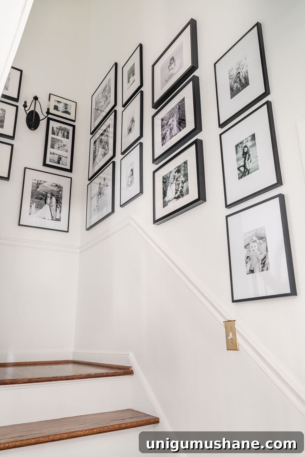 black and white staircase gallery wall