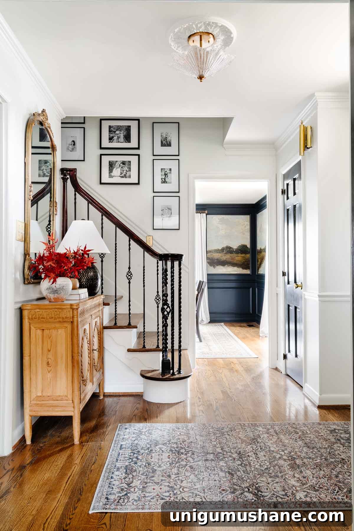 foyer ideas : gallery wall, entryway table, and rug