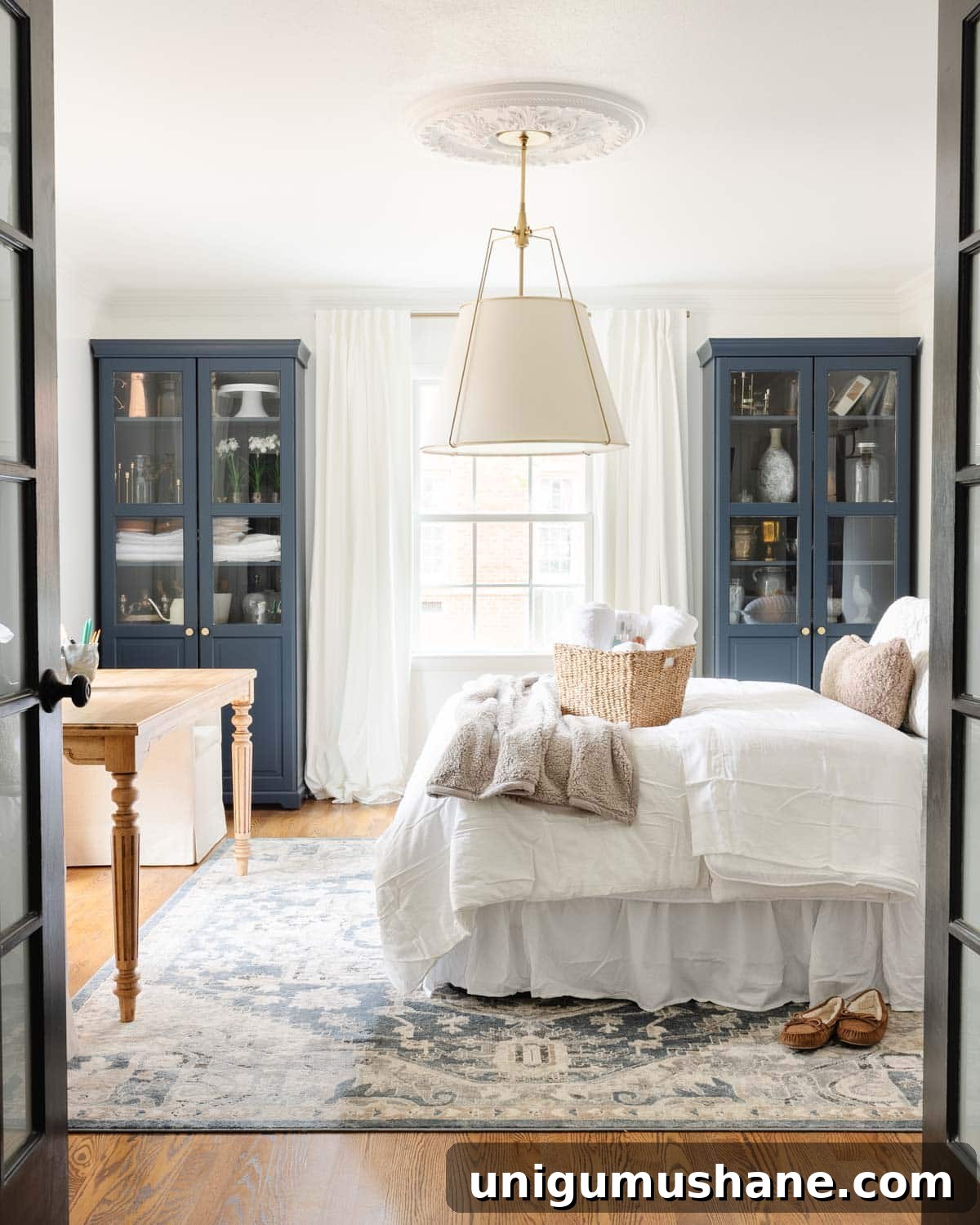 a home office set up as a temporary guest room and making an air mattress comfortable like a real bed