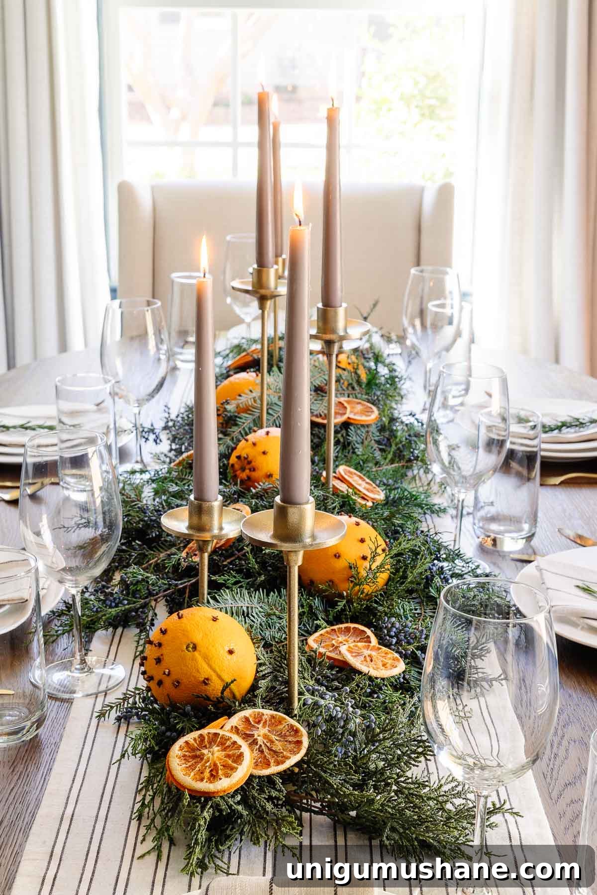 dried orange, evergreen, and juniper berry simple Christmas table centerpiece
