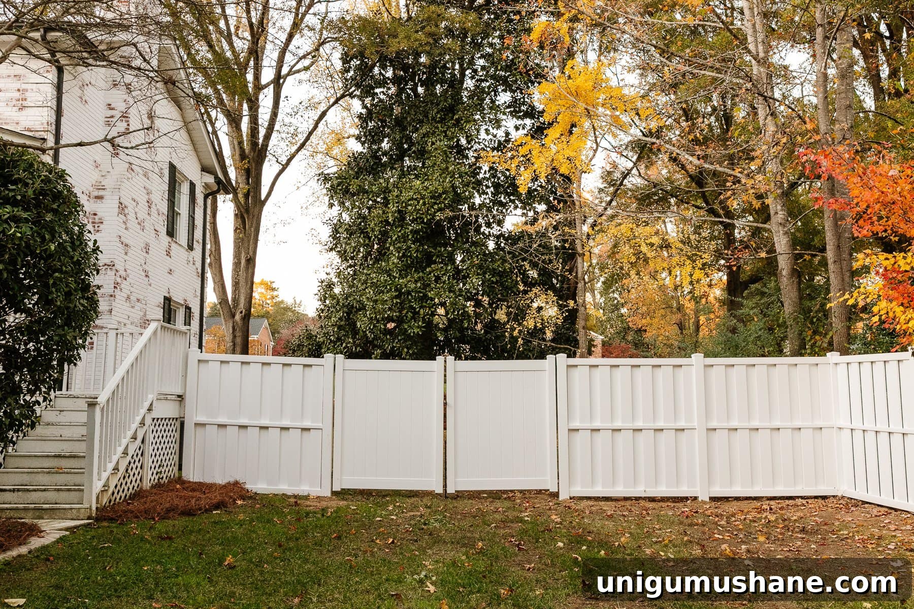 Vinyl Fence Installation: Costs, Materials, and Tips 23 white vinyl fence installation in a backyard using Ply Gem