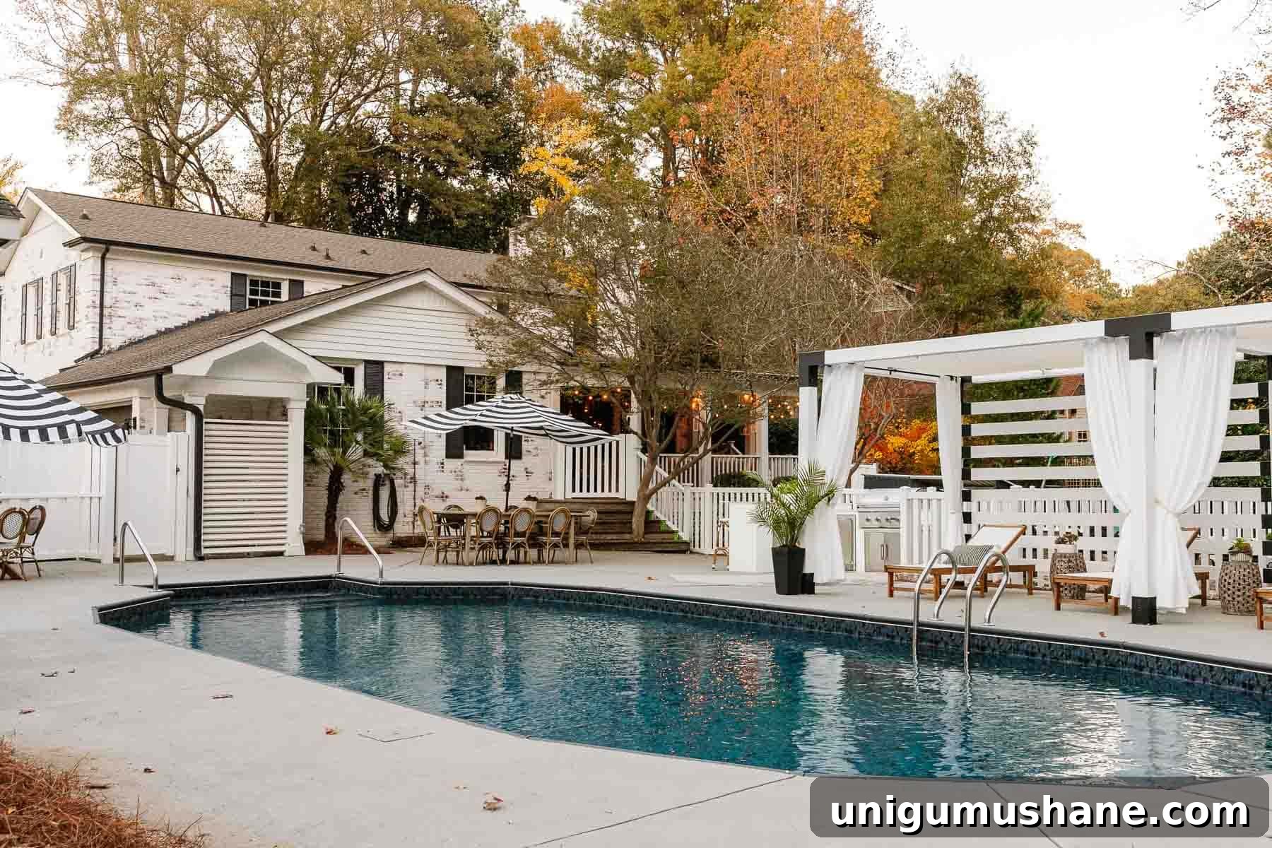 Vinyl Fence Installation: Costs, Materials, and Tips 27 backyard pool after with pergola, new swimming pool liner, outdoor furniture, and outdoor kitchen