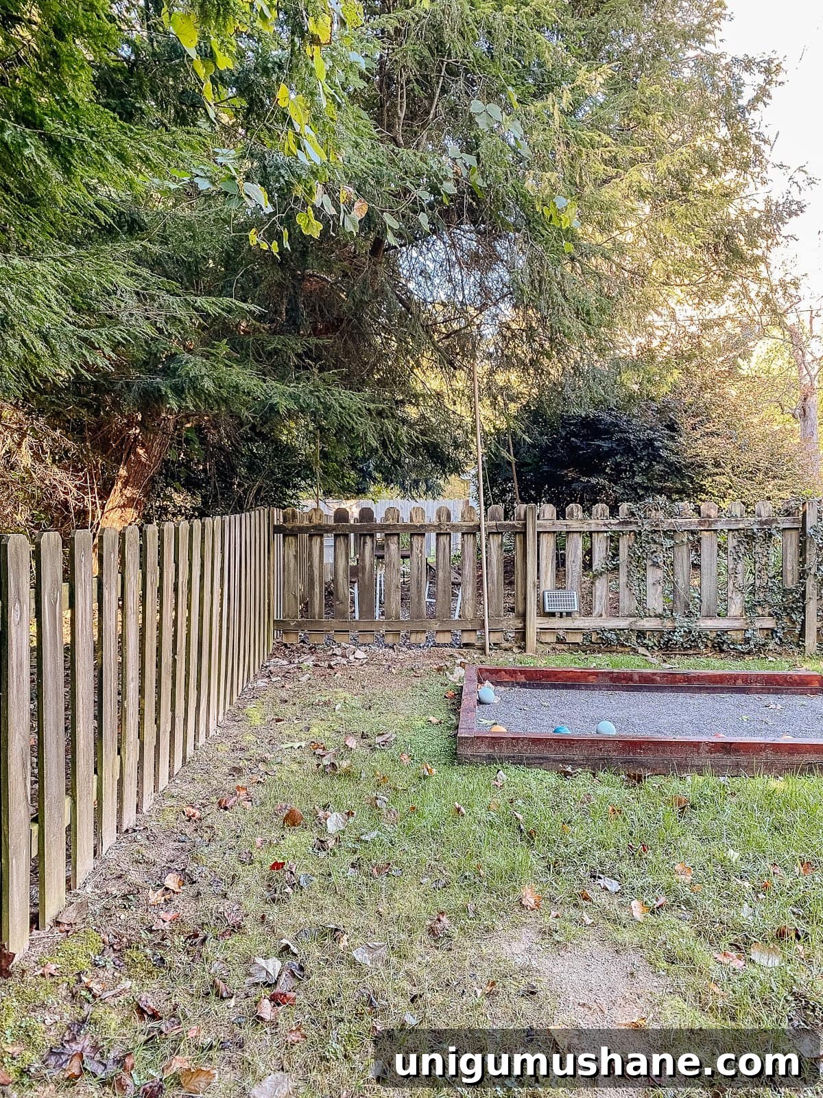 Vinyl Fence Installation: Costs, Materials, and Tips 9 backyard bocce ball court with wood fencd