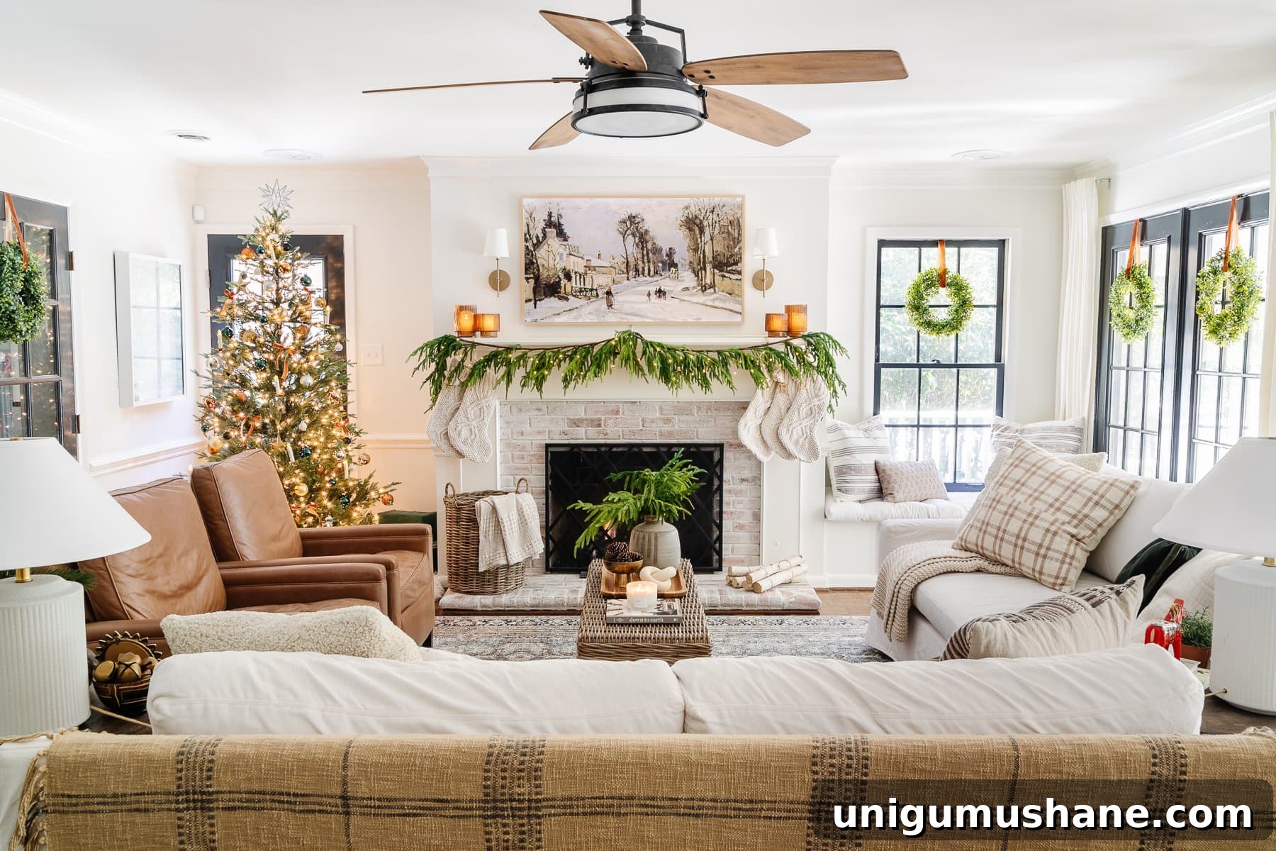 Holiday Housewalk 2021: Traditional Christmas Decorating Ideas 20 neutral living room christmas with wreaths on windows and realistic garland