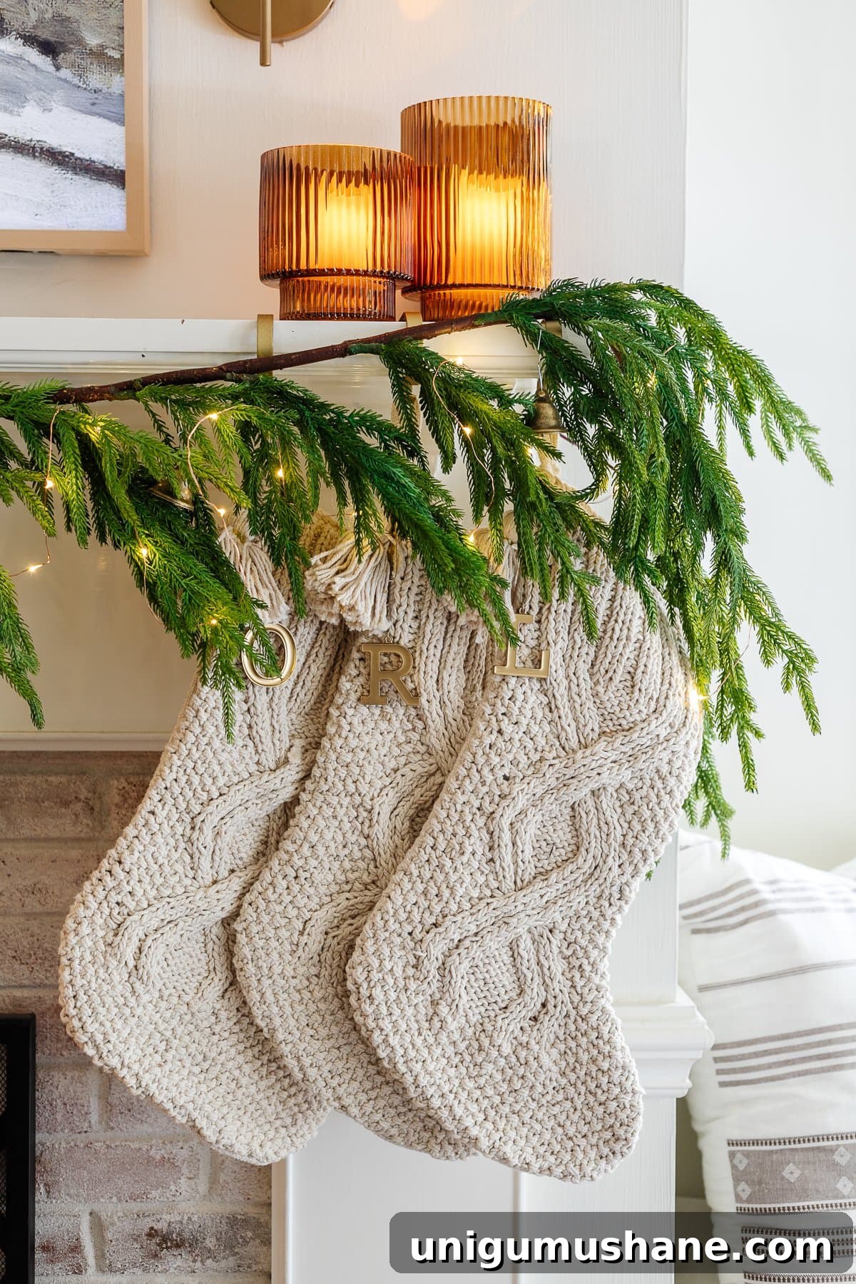 Holiday Housewalk 2021: Traditional Christmas Decorating Ideas 24 cable knit Christmas stockings with spray painted initial tags