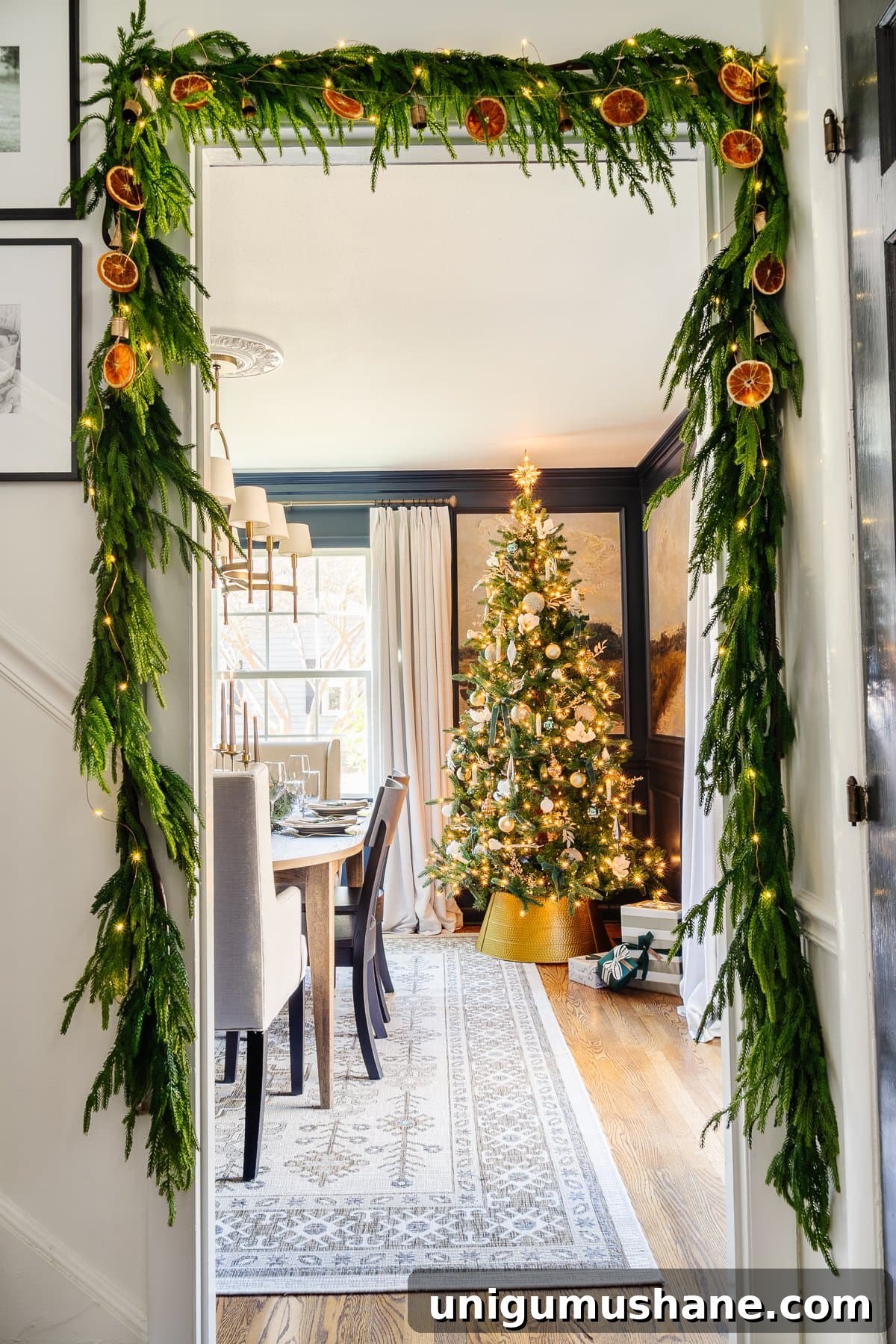 dried orange garland on greenery around. adoorway