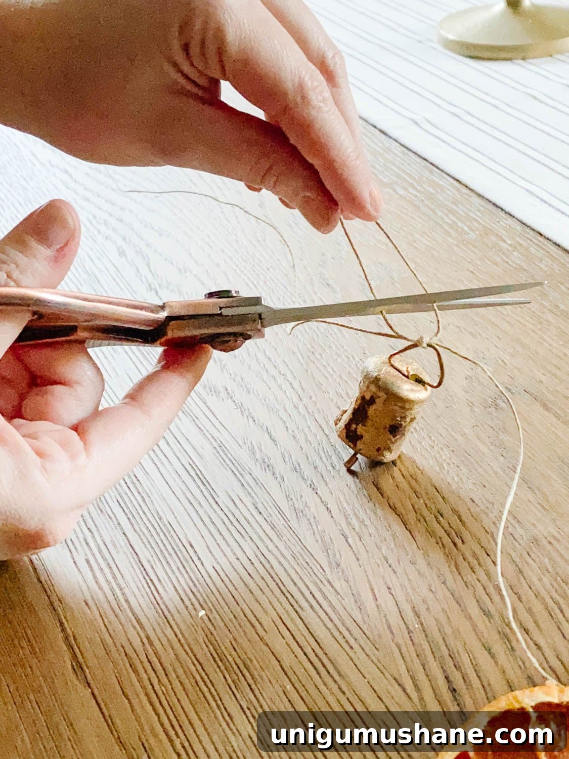 cutting long ends of twine on mini brass bells