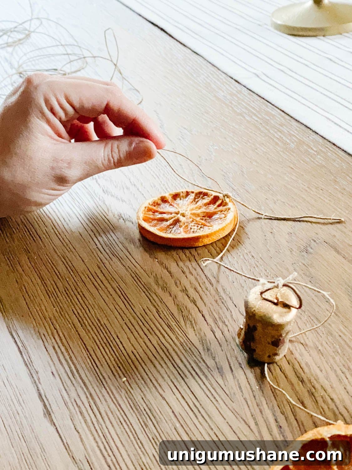 how to tie dried orange slices onto garland