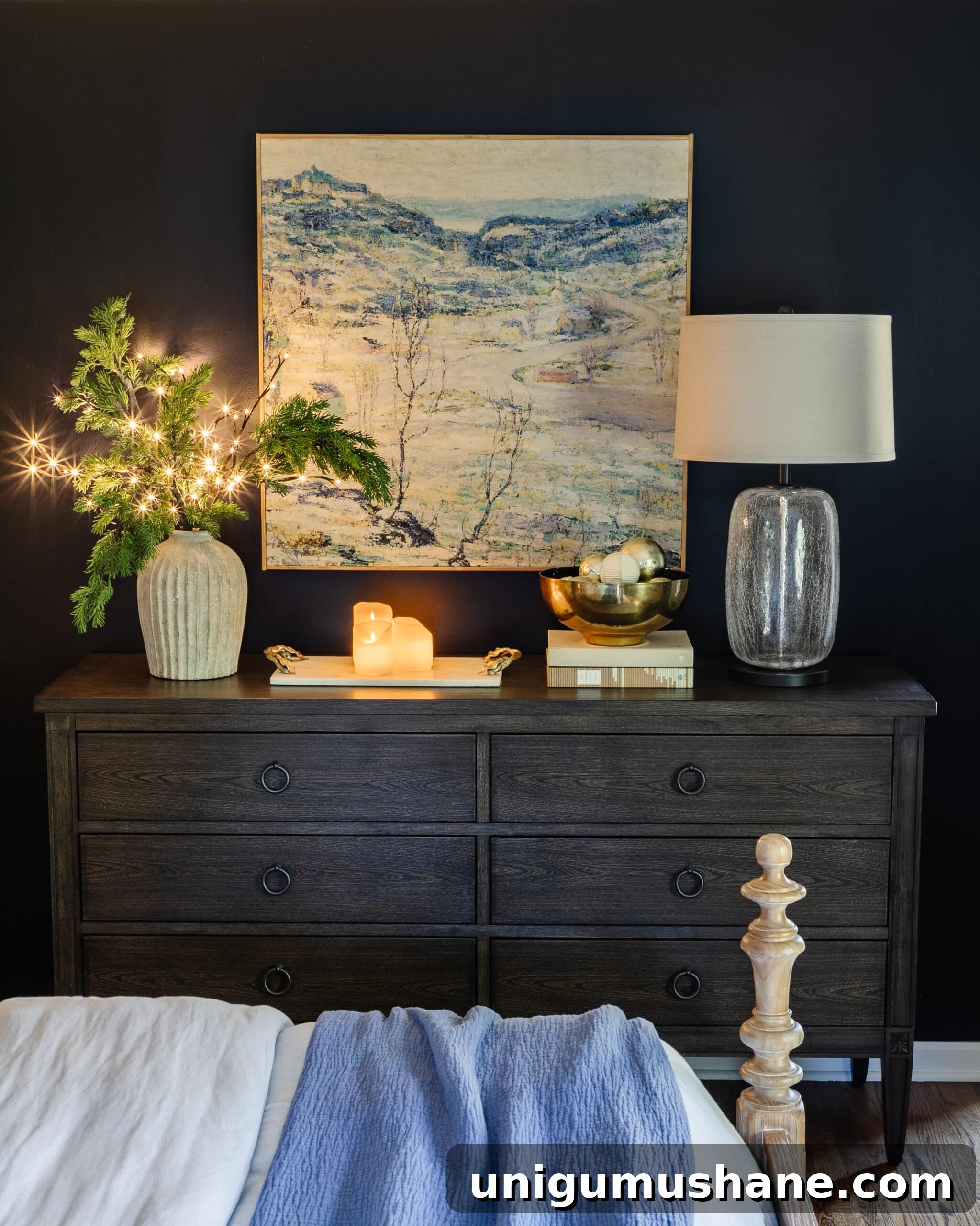 bedroom dresser Christmas decor with vase of pine branches, candles, and bowl of ornaments