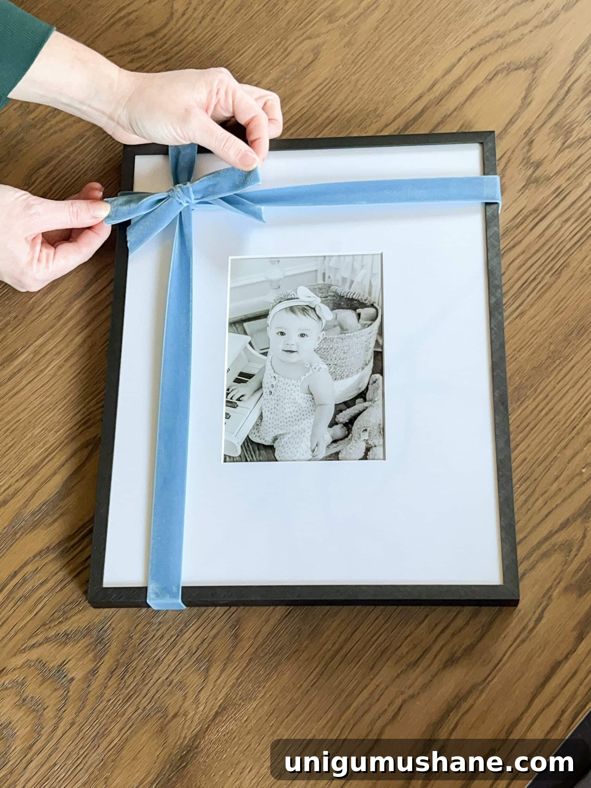 tying a bow around a picture frame