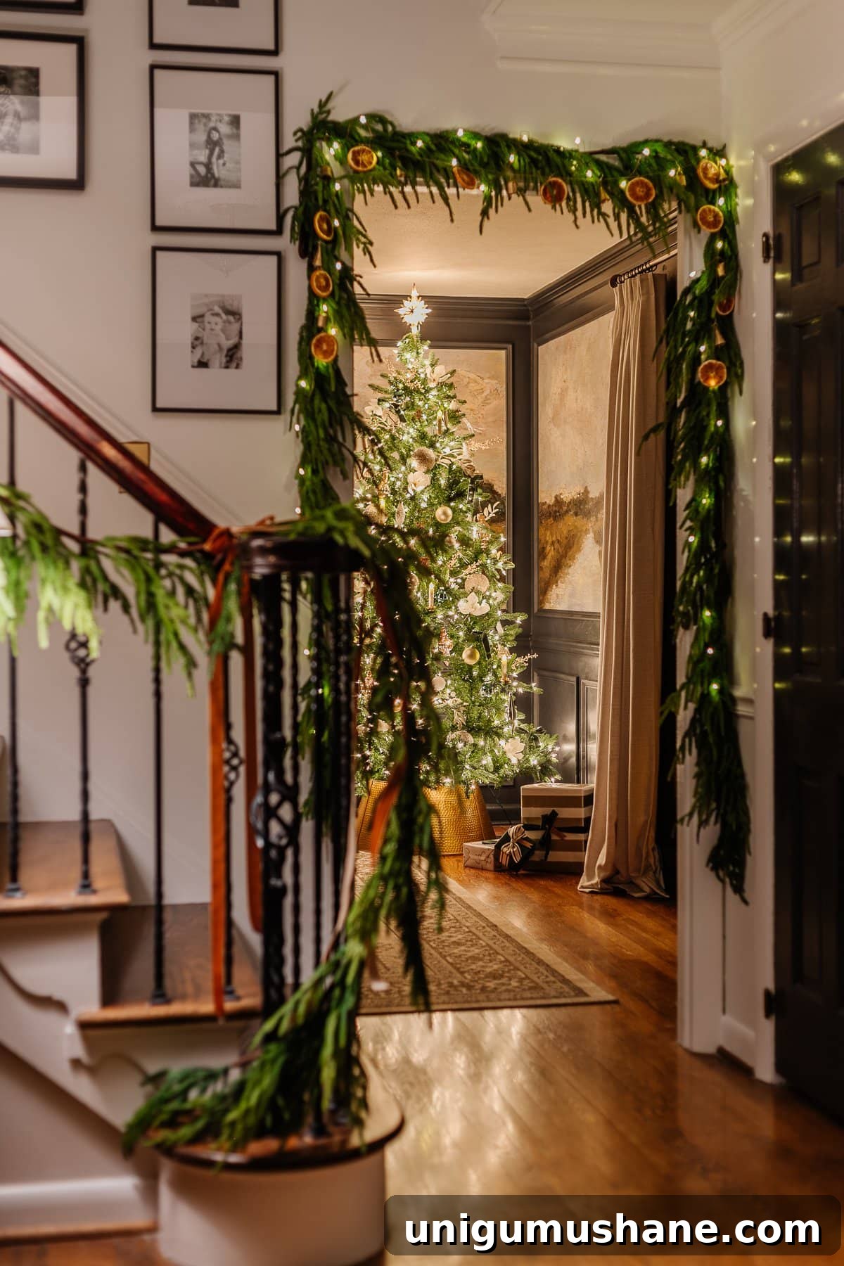 Christmas Candlelight Home Tour: Cozy Holiday Decor Ideas 6 Christmas candlelight in foyer looking into dining room tree