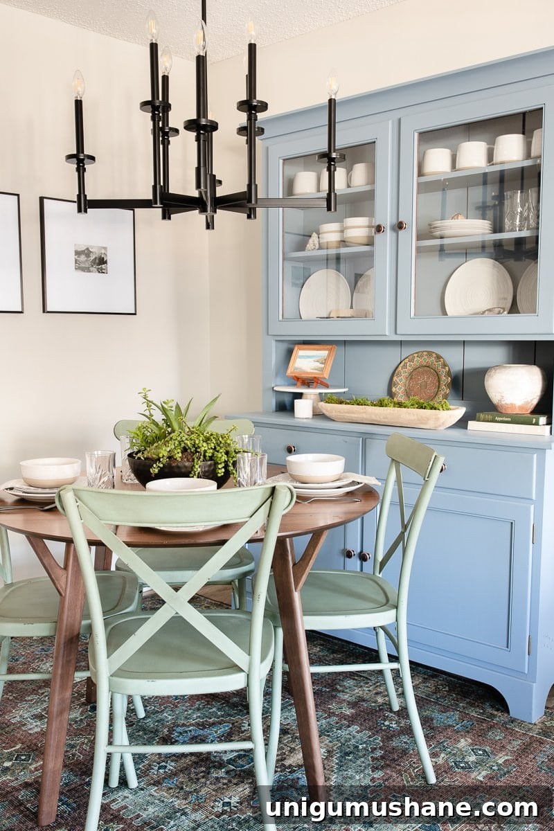Refresh Your Small Dining Nook: 7 Quick Ideas 5 colorful dining room nook blue china cabinet green dining chairs