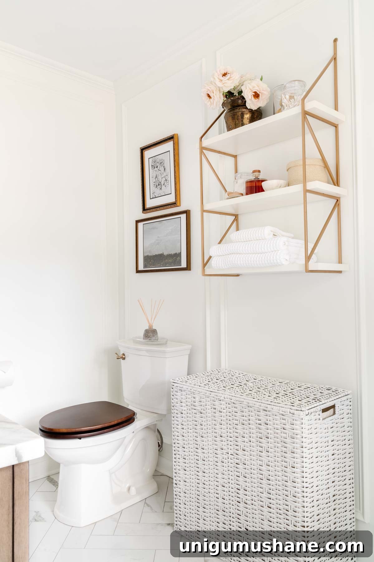 How Much Does a Bathroom Remodel Cost? Budget Breakdown 5 picture frame molding in a bathroom with wall shelves and toilet with wood toilet seat