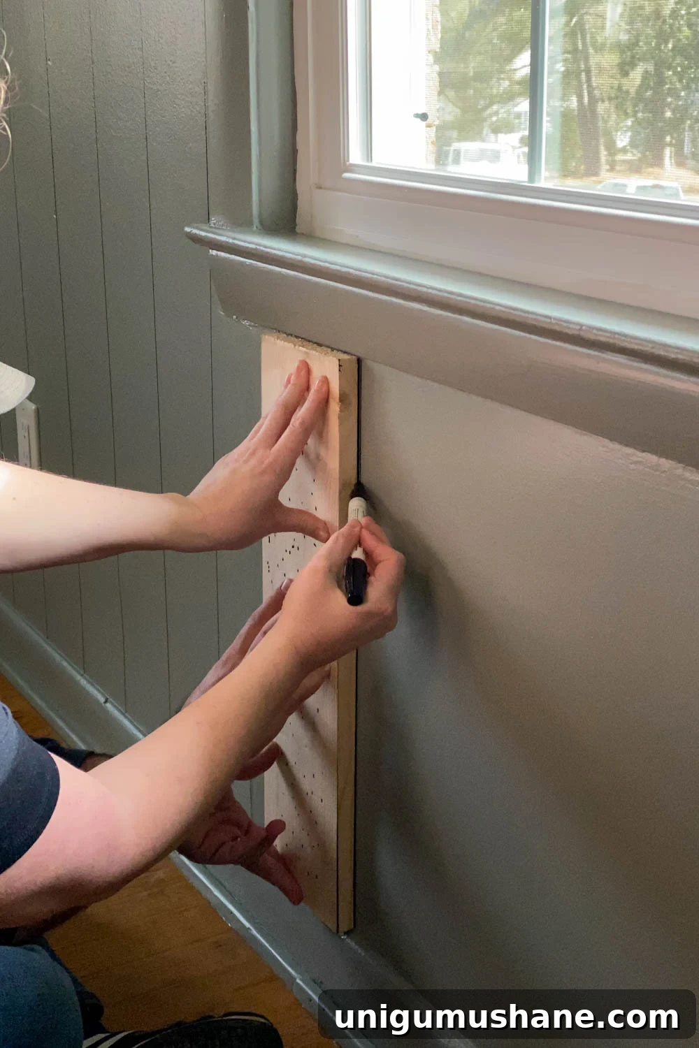 DIY Faux Wall Planking: Transform a Room for $20 10 Tracing 1x6 boards with Sharpie paint pens for faux paneled walls under a window