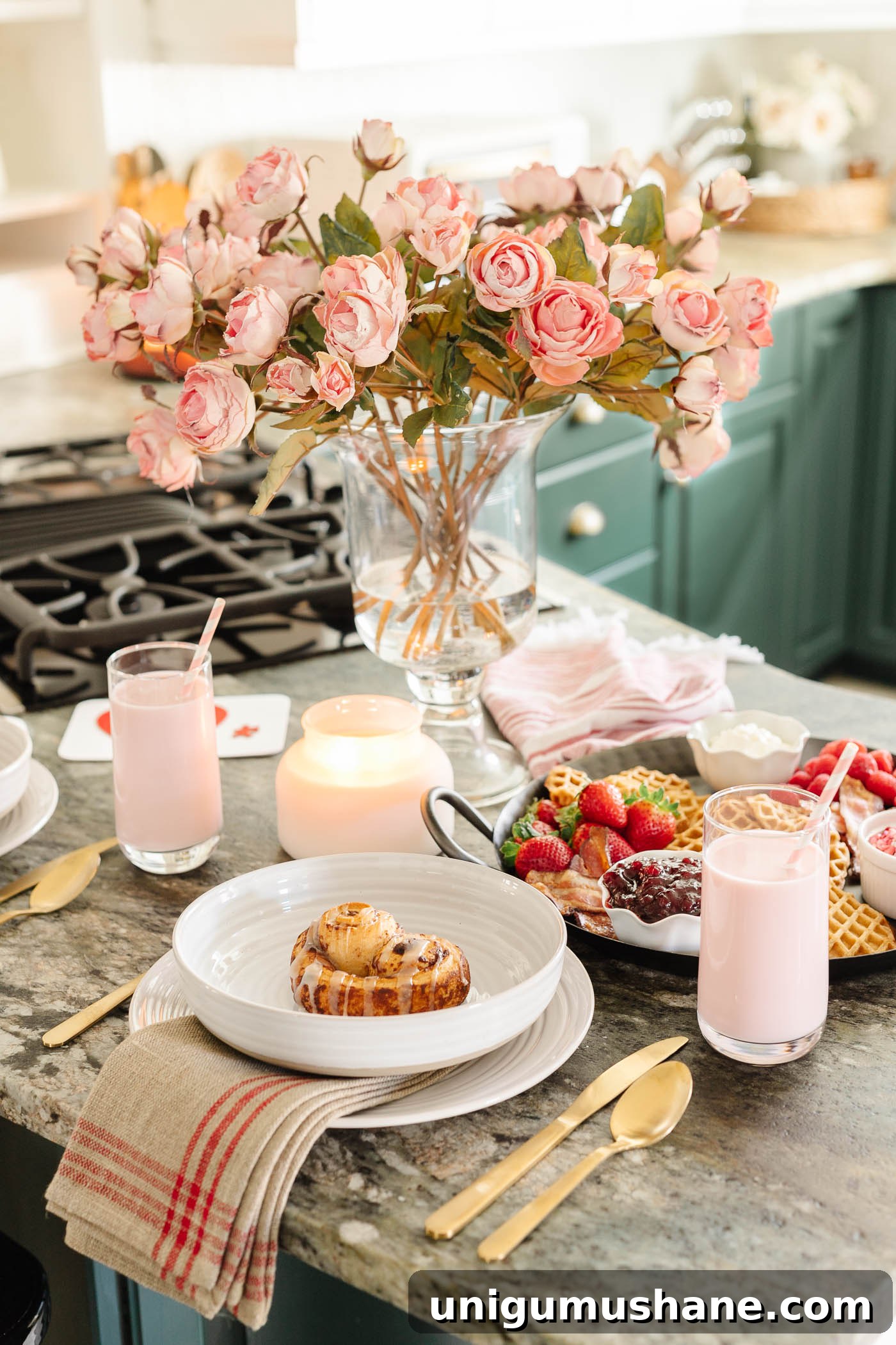 Valentine's Day Breakfast Charcuterie Board for Two 7 Valentine's Day breakfast charcuterie board with place settings on kitchen counter and pink roses with candles