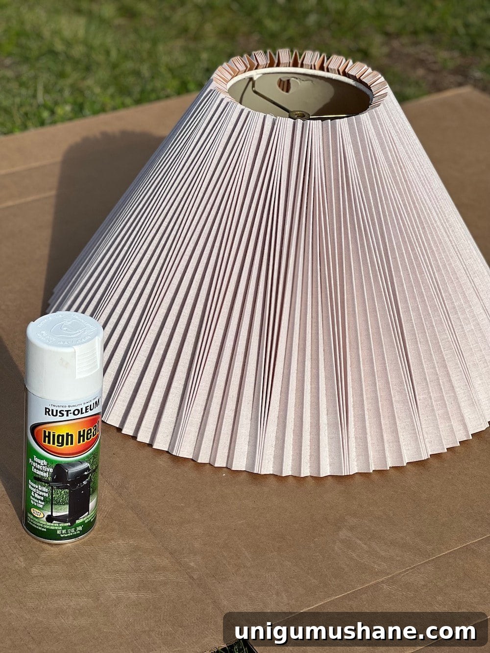 Transform Rustic Table Lamps into Affordable Designer Dupes 8 spray painting a pleated lamp shade
