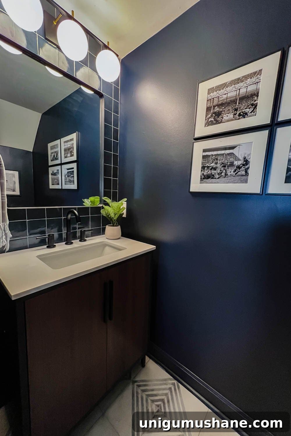 Small Modern Powder Room Makeover for Your Bachelor Pad 7 vintage football art prints in a masculine bachelor pad powder room