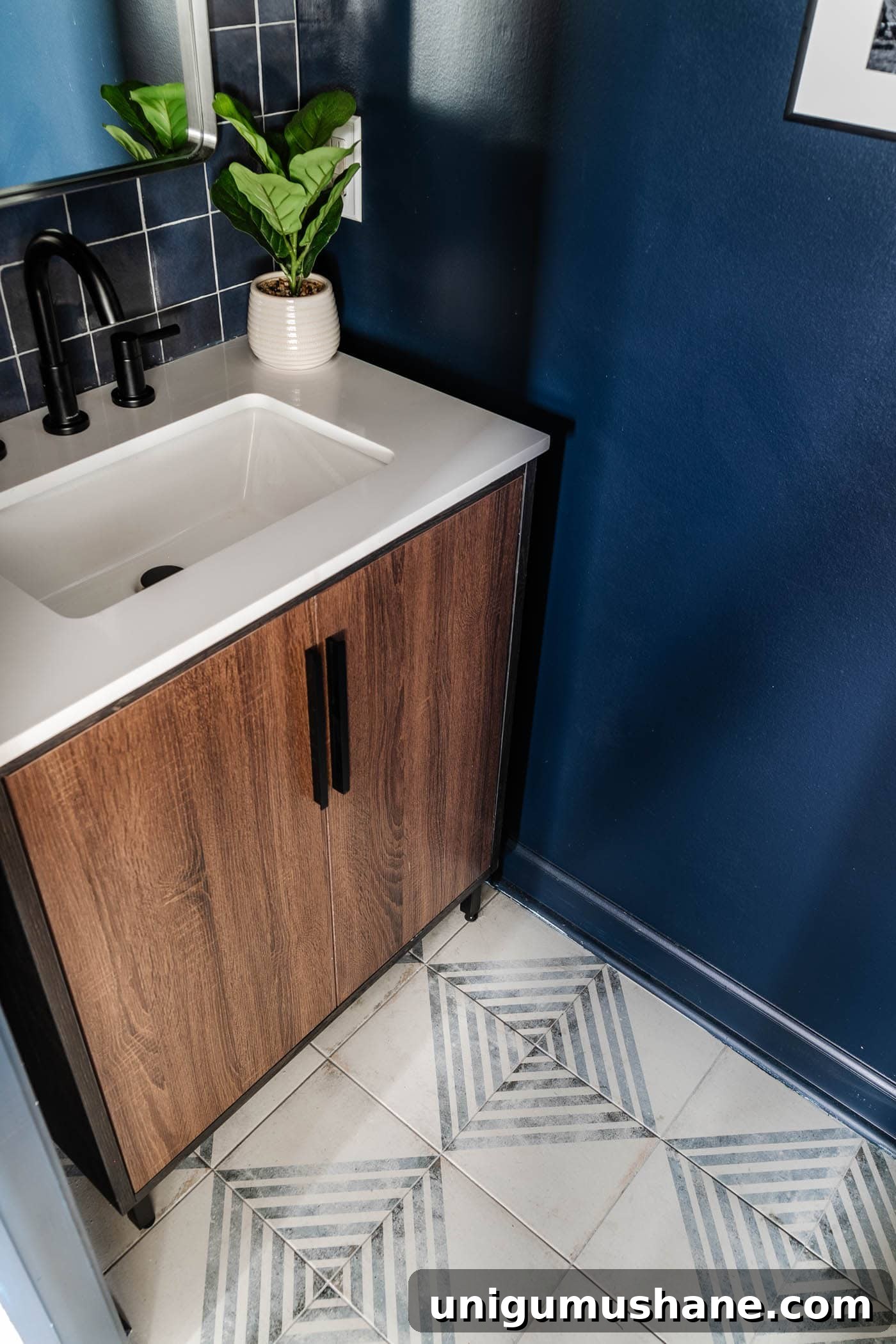 Small Modern Powder Room Makeover for Your Bachelor Pad 9 patterned tile and wood vanity with navy blue walls