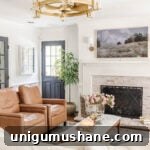 Favorite Fandeliers (Fan Chandeliers) We Own and Love 7 glass and gold fandelier in a living room with limewashed brick fireplace white walls and black doors