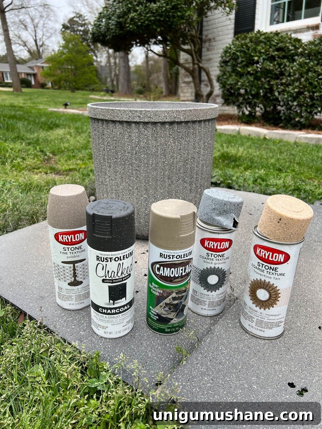 How to Make Faux Concrete Planters with Spray Paint 8 faux DIY concrete planters made with different neutral colors of leftover spray paint