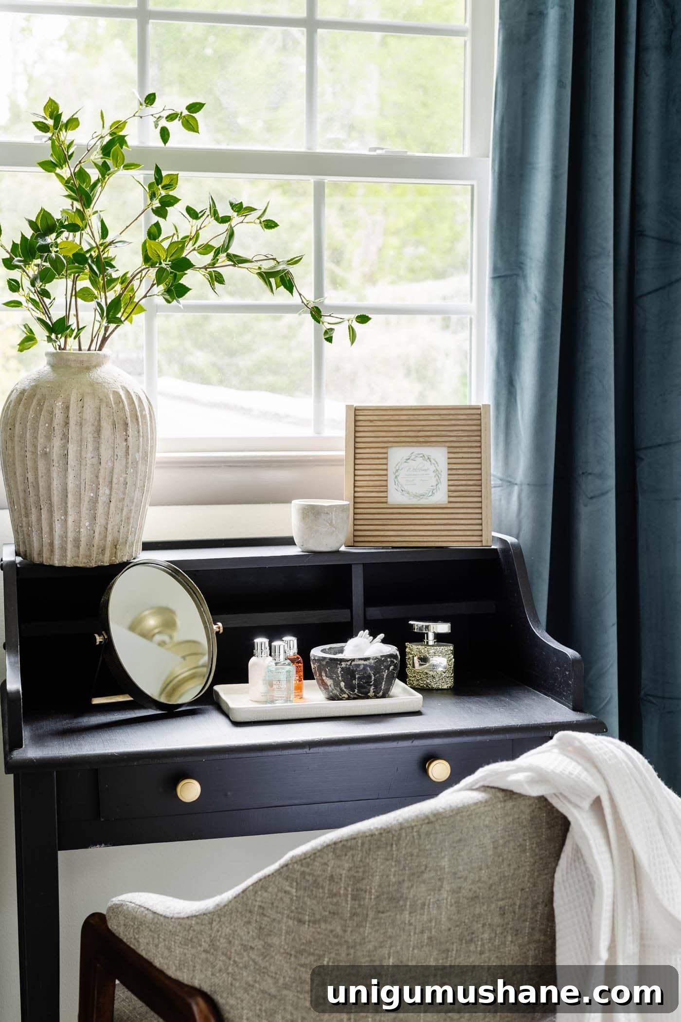 How to Redecorate a Room in Under an Hour: Guest Bedroom Refresh 12 guest bedroom vanity in front of window