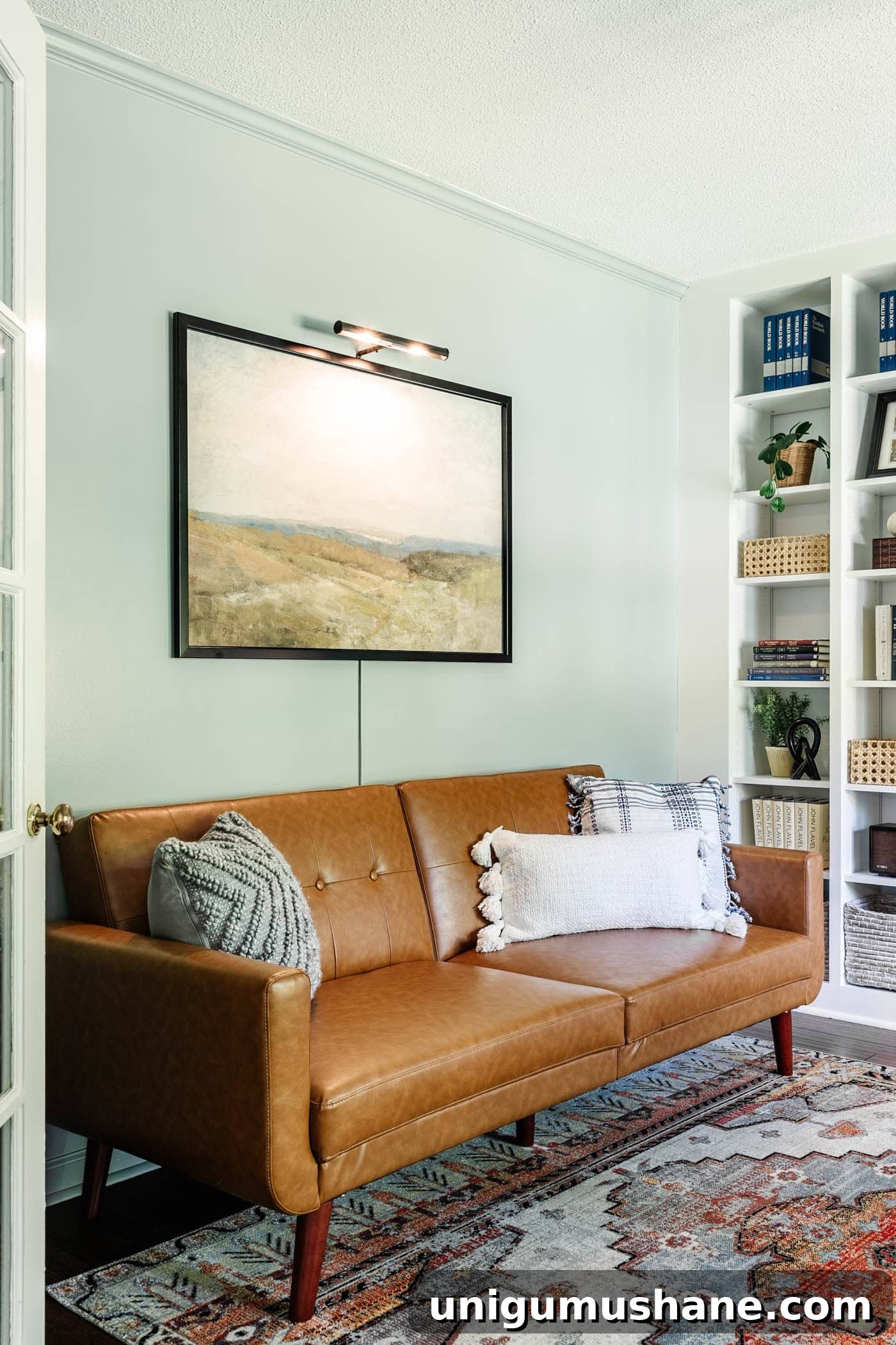8 Lounge-Style Home Office Ideas to Boost Productivity 2 home office lounge area with faux leather futon