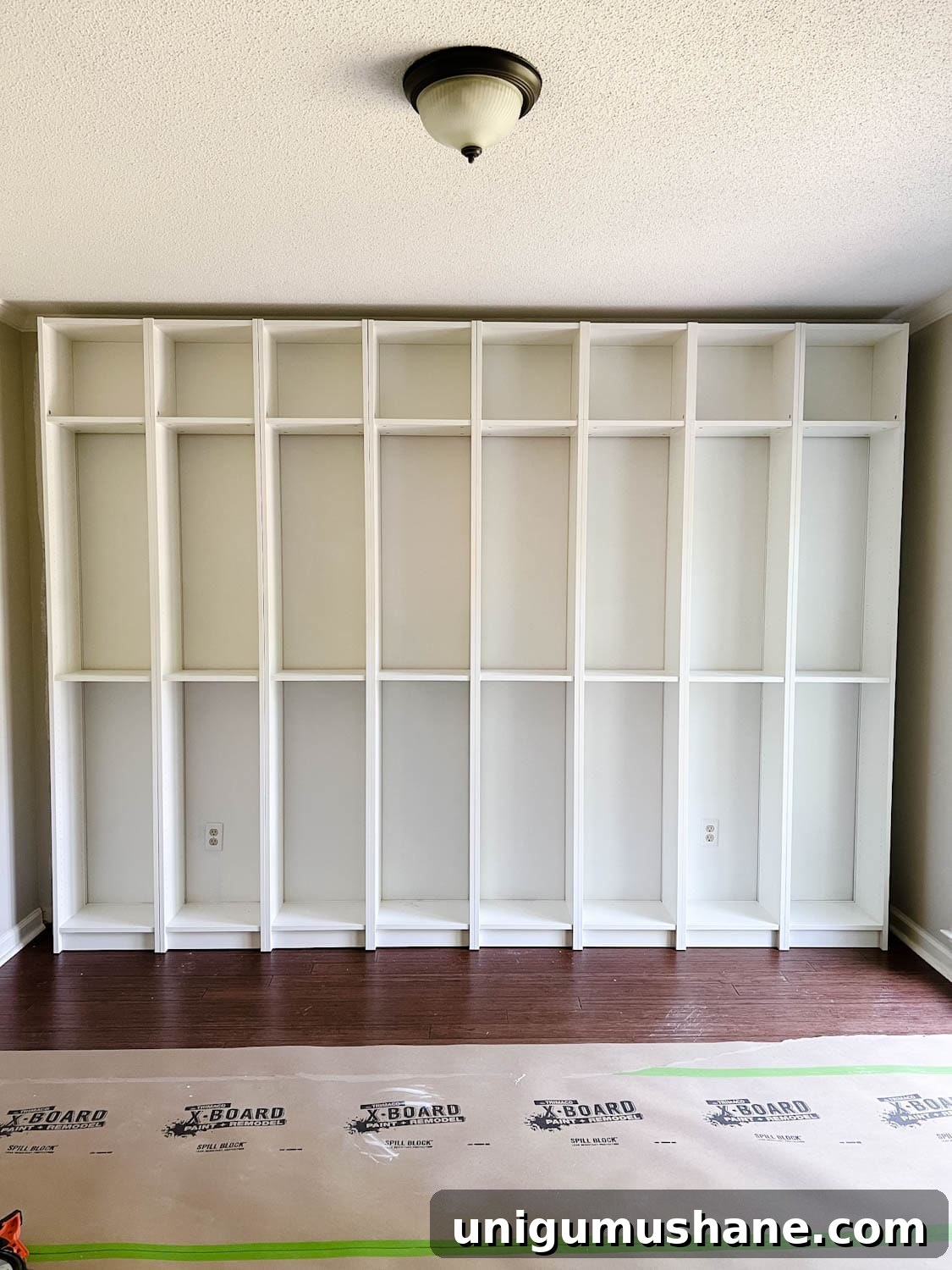 Convert IKEA Billy Bookcases into Built-In Bookshelves 12 attached and anchored bookcases to the wall to make DIY built in bookshelves