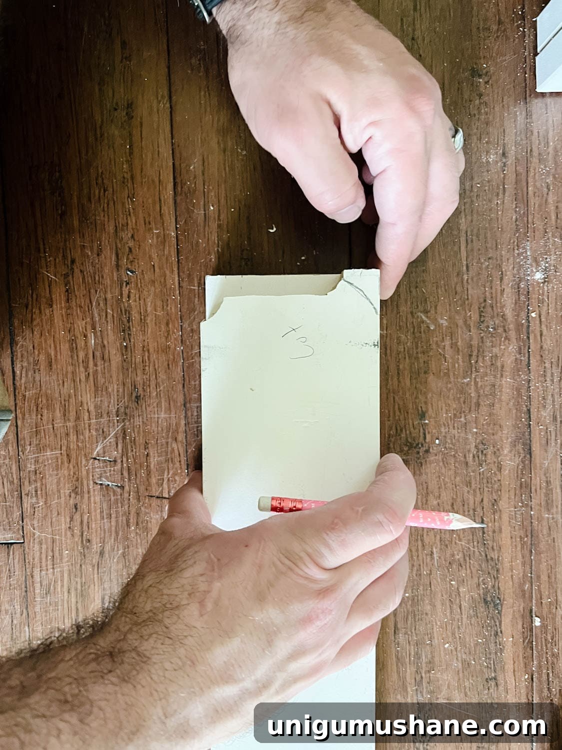 Convert IKEA Billy Bookcases into Built-In Bookshelves 16 marking the shape of a baseboard to a 1x4 board to cut
