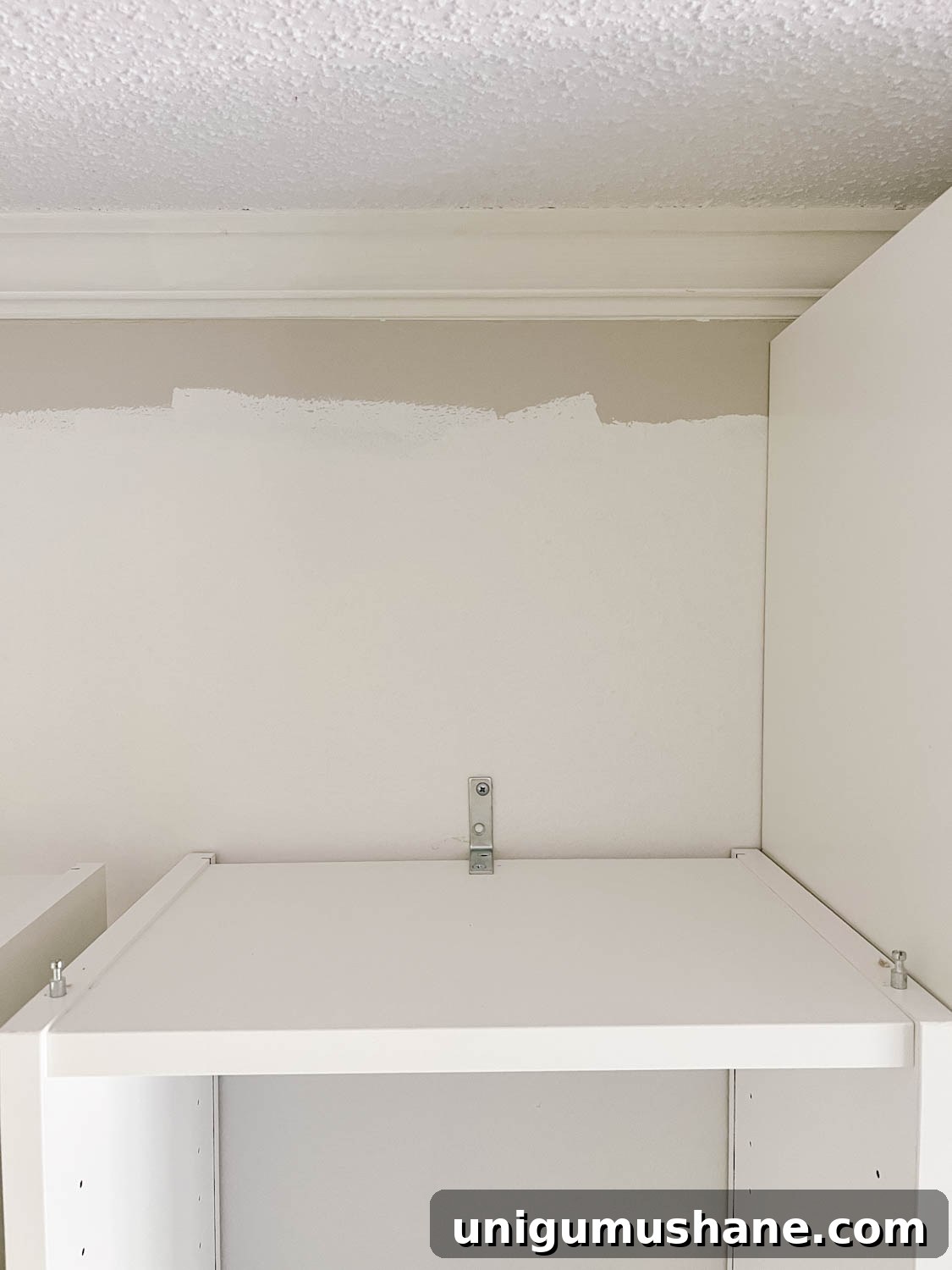Convert IKEA Billy Bookcases into Built-In Bookshelves 9 anchor added to the back of a bookcase to keep it attached to the wall