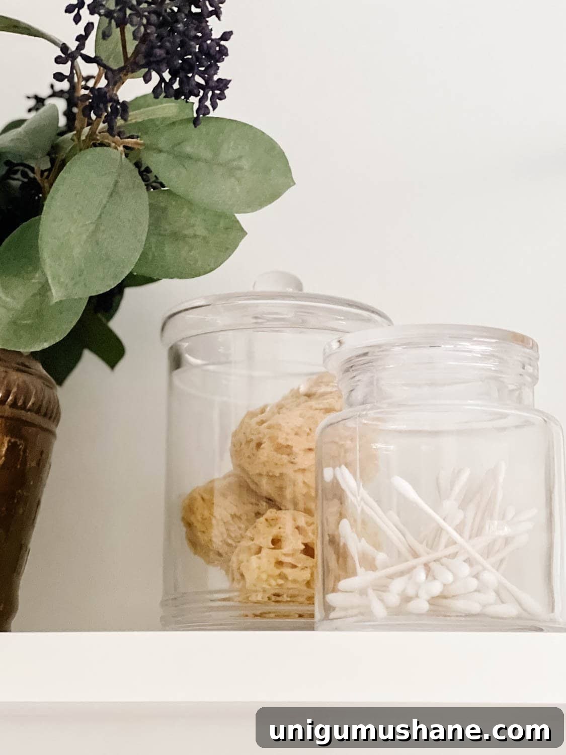 Affordable Spa Bathroom Ideas to Create a Luxury Home Retreat 10 apothecary jars with q tips and bath sponges for spa bathroom storage