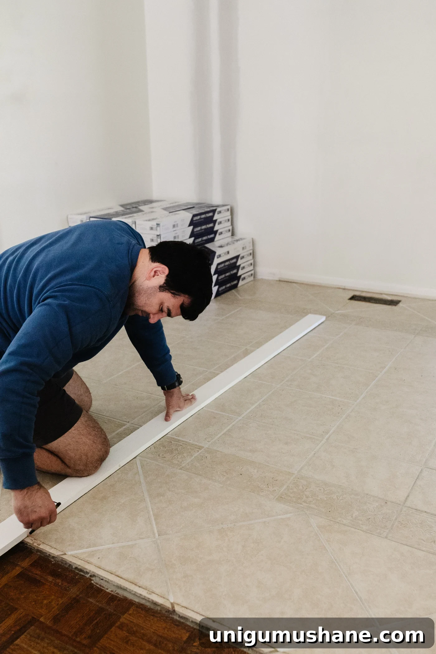 marking the starting line to install LVP floating floor over tile