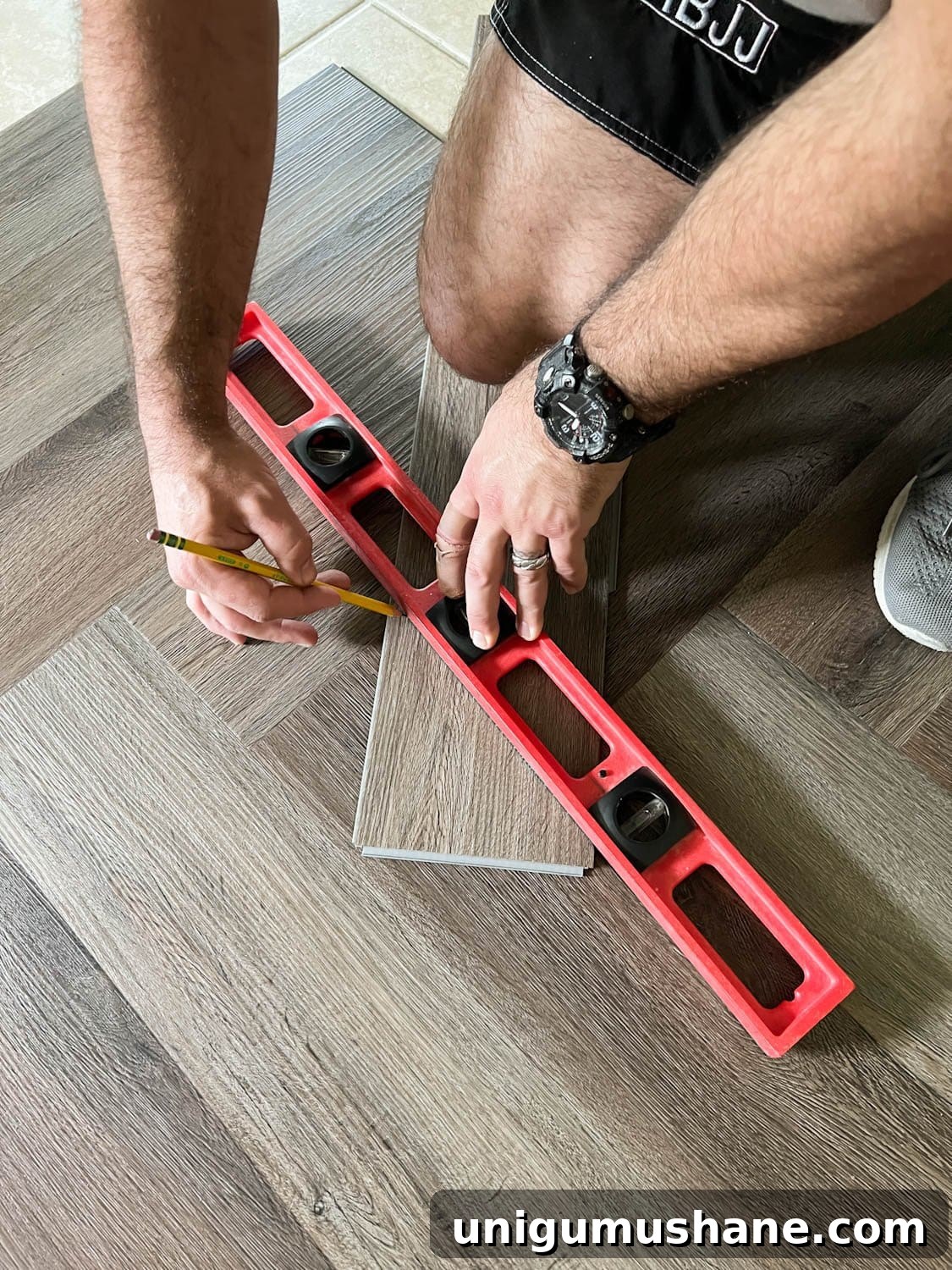 marking measurements on a piece of LVP to cut and fit
