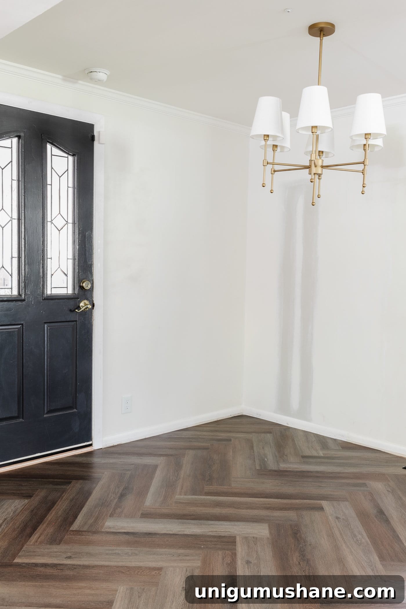 finished herringbone LVP floating floor installation in a breakfast nook