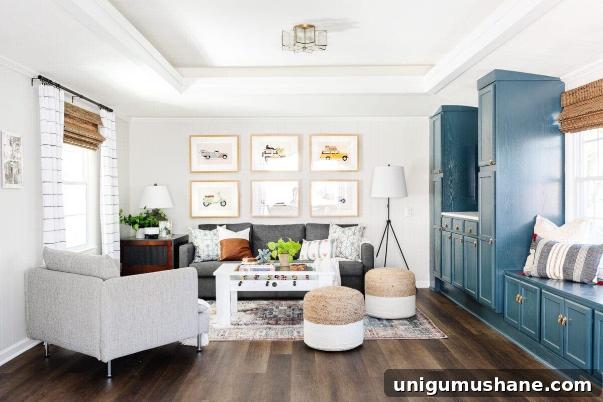 rec room playroom with blue cabinets, sofa, and foosball table with LVP flooring